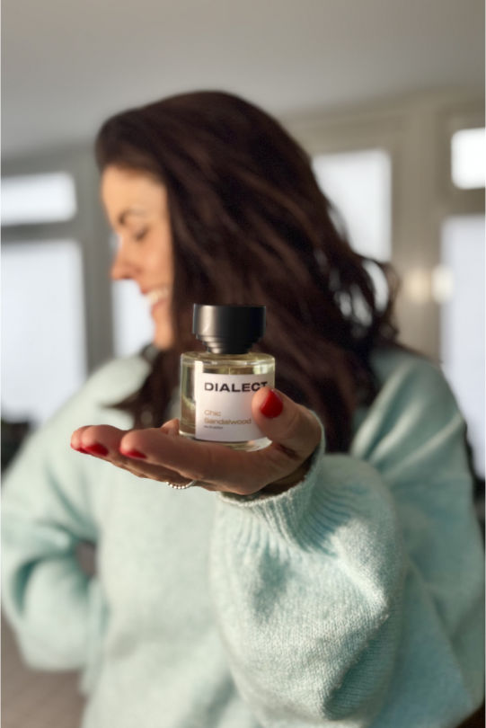 woman holding Dialect bottle